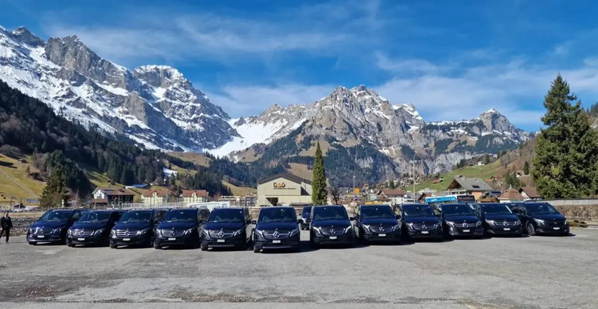 Best Taxi Service vehicles in front of the Alps